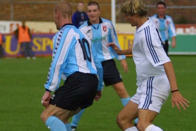 Jamie Hughes is put under pressure during Derry City's friendly with Real Madrid.