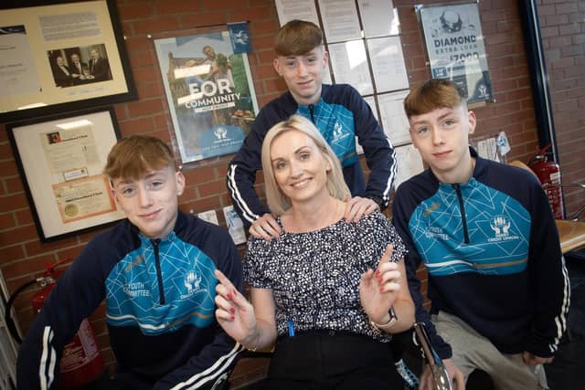 SEEING TREBLE!. . . .Credit Union's Clare McLaughlin with her triplet sons Gray, Cian and Ryan during Saturday's International Creidt Union Day celebrations in Abbey Street. : .