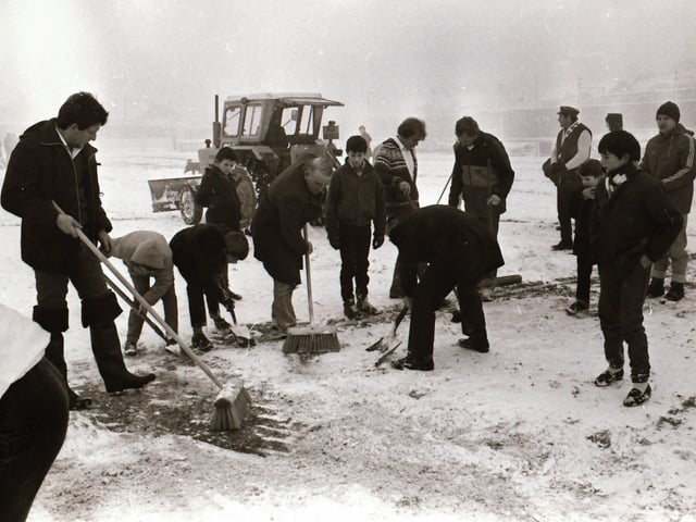 Derry City V EMFA at the Brandywell - snow clearing before the match.