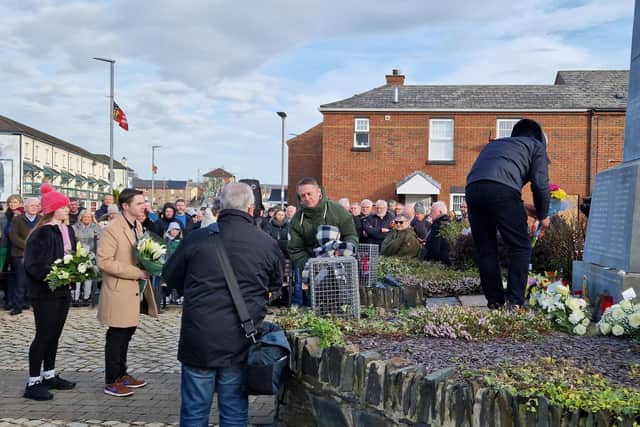 Relatives leave wreaths at the Bloody Sunday Monument on Sunday morning.