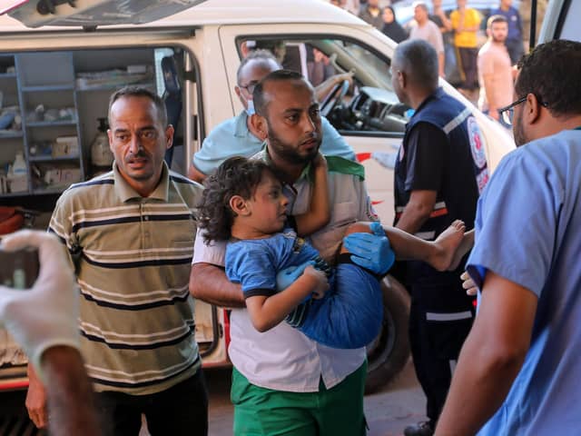 KHAN YUNIS, GAZA - OCTOBER 26: Palestinians injured in Israeli air raids arrive at Nasser Medical Hospital on October 26, 2023 in Khan Yunis, Gaza. Heading into a third week of heavy bombing from Israel, Gaza buckles under a shortage of basic needs including fuel, whilst several neighbourhoods on the Gaza strip have been wiped out and thousands have died and hundreds of thousands have been displaced. On October 7, Hamas launched a deadly attack in southern Israel that sparked a retaliatory siege of Gaza. (Photo by Ahmad Hasaballah/Getty Images)