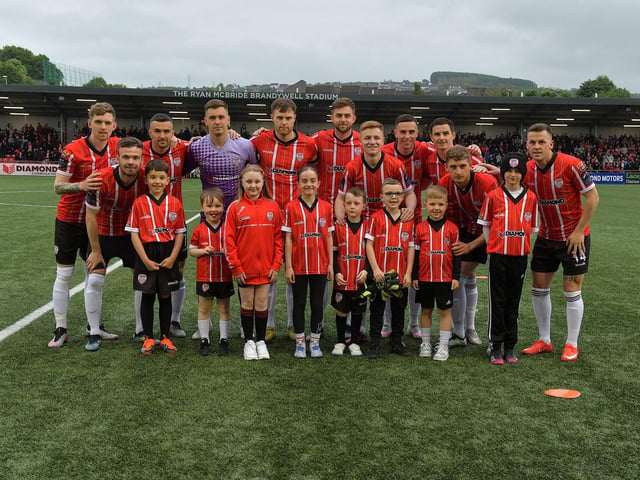 Mascots pictured with the Derry City starting eleven for the game against UCD on Friday evening last. Photo: George Sweeney.  DER2320GS – 137