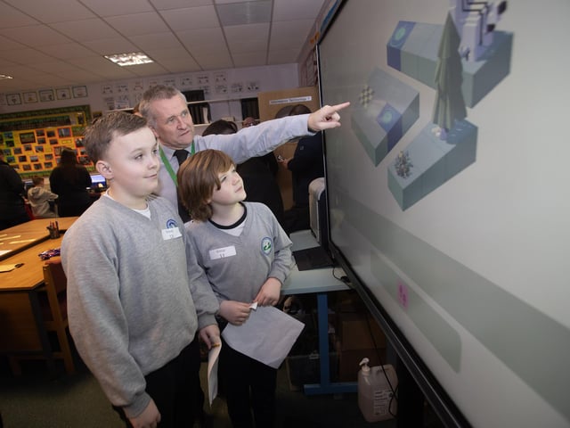 IT teacher Mr. Gerry McBride instructing Sacred Heart PS pupils Diarmuid Cox and Mason Monaghan on Rodo Codo on the whitescreen during Friday's Open Day. (Photos: Jim McCafferty Photography)