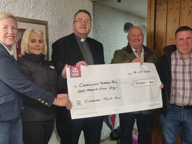 The Inishowen Truck Run raised funds for two local charities Donegal Hospice and Creeslough Tragedy Fund. A cheque for €7000 was presented recently to Father John Joe Duffy. Pictured L to R: Caroline Gurney, Jacqueline Duffy, Fr John Joe, Kevin O'Connor and Mickey Highboy