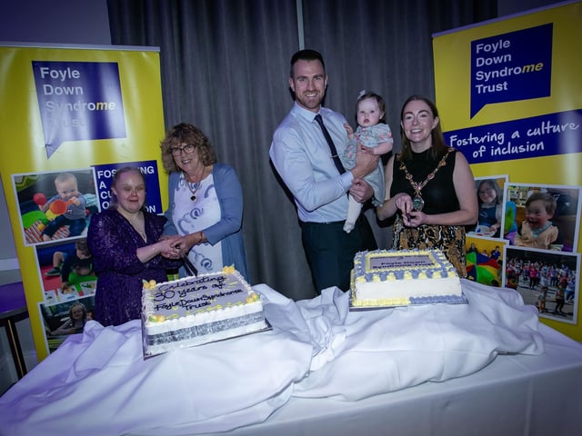 Cutting the cake at the celebration of 30 years of the Foyle Down Syndrome Trust at the Everglades Hotel on Friday last are, from left, Nicola Harkin, Angela Thompson, Christopher Cooper, baby Bethany Pugh and Grace Ui Niallais, Mayor of Derry City and Strabane District Council. (Photos: Jim McCafferty Photography)