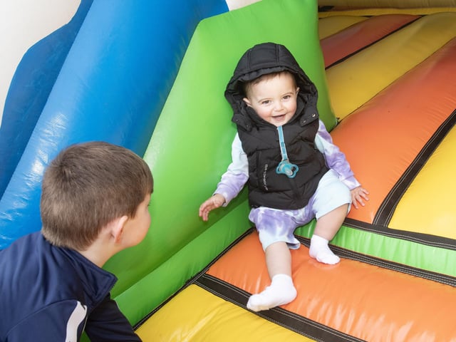 One year old Jamie Melaugh having a ball on the bouncy castle.