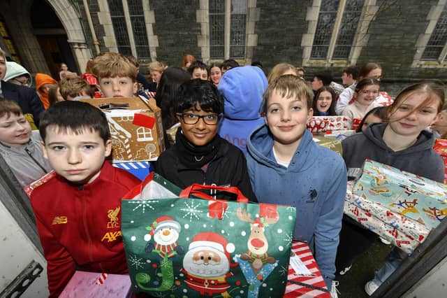 Pupils from Lumen Christi College pictured with some of the hundreds of Christmas presents for Ukrainian children donated by pupils, their families and friends. This is the fourth year that pupils from the school have collected gifts for children of Ukraine. Photo: George Sweeney