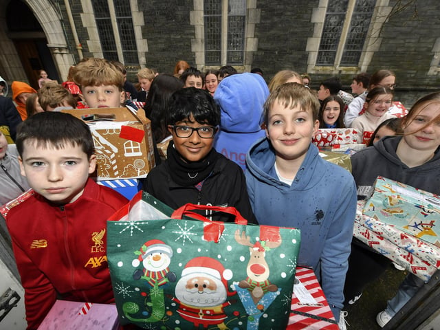 Pupils from Lumen Christi College pictured with some of the hundreds of Christmas presents for Ukrainian children donated by pupils, their families and friends. This is the fourth year that pupils from the school have collected gifts for children of Ukraine. Photo: George Sweeney