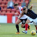 BRANDYWELL BOUND . . . Former Airdrie midfielder, Adam Frizzell (21) on left, fouls Falkirk's Leon McCann.