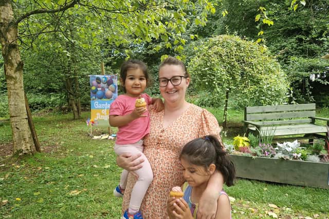 Trisha and Naoise with mum Noella Hutton, from North West BAPs, enjoying cupcakes at the opening of the Garden of Angels