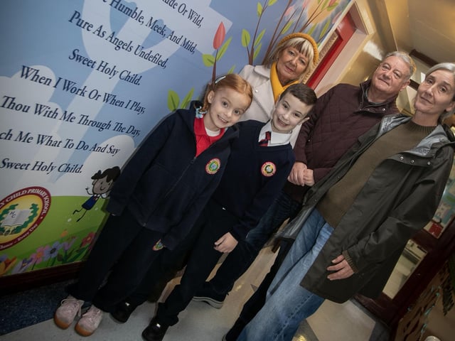 Grandparents pose for a picture with their grandchildren to celebrate Catholic Schools Week 'Grandparents To School' Day at Holy Child PS. (Photos: Jim McCafferty Photography) : .