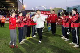 Derry City manager Pat Fenlon makes his way onto the pitch at the Brandywell for their Setanta Cup game against Linfield in 2007.