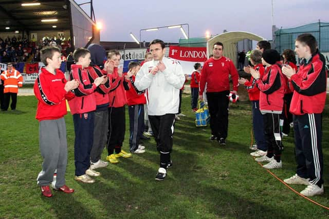 Derry City manager Pat Fenlon makes his way onto the pitch at the Brandywell for their Setanta Cup game against Linfield in 2007.