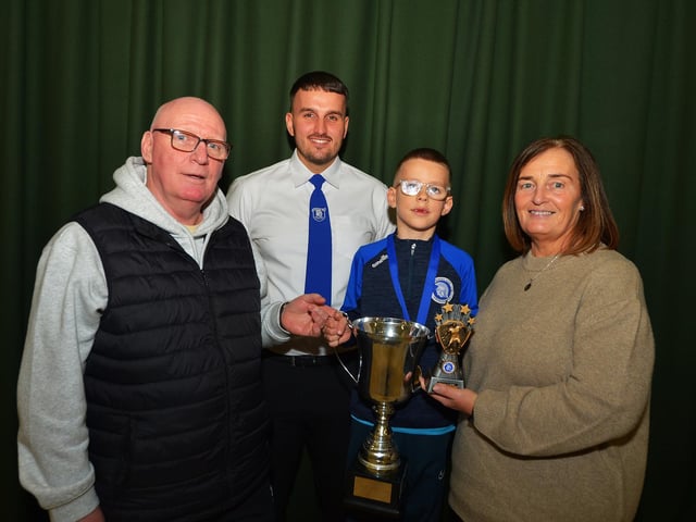 Thomas O’Hagan received the Thomas Burke Award at the Trojans FC annual Youth Presentation held in St Cecilia’s College. Included in the photo are Thomas O’Hagan senior, Diolain Ward (Vice-chairperson) and Linda O’Hagan. Photo: George Sweeney