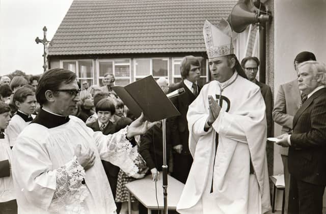 Reverend Dr Edward Daly, Bishop of Derry, blessing the school during its official opening in 1975.