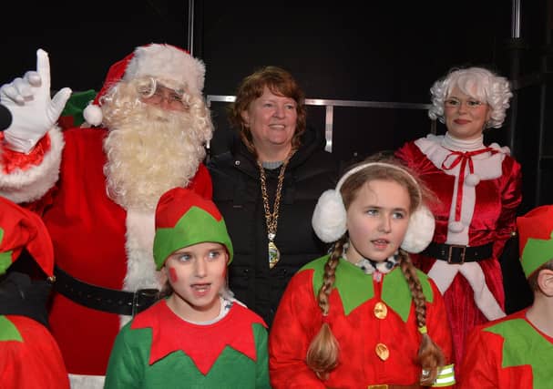 The Deputy Mayor of Derry and Strabane, Alderman Niree McMorris pictured with children from Culmore Kids Club, Santa and Mrs Claus at the Culmore Community Hub on Friday night. Photo: George Sweeney