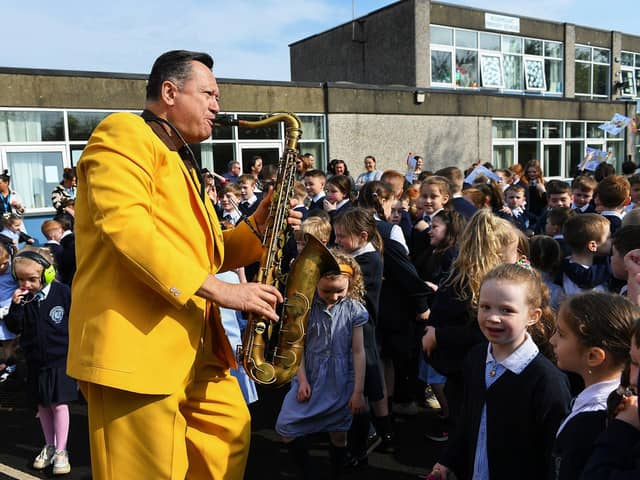 John Fordham of the Jive Aces performing at Rosemount Primary School on Thursday morning. Photo: George Sweeney