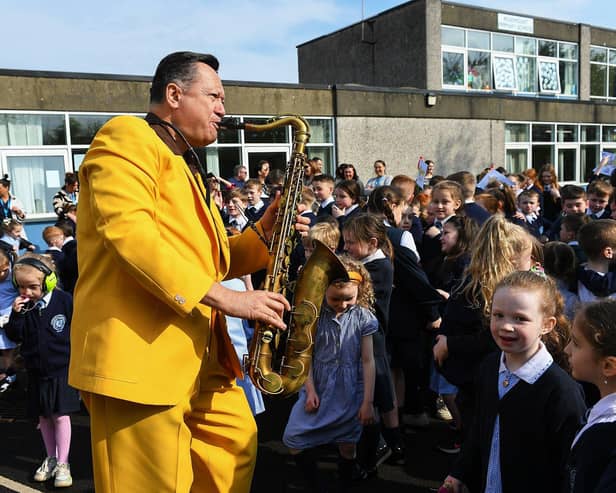 John Fordham of the Jive Aces performing at Rosemount Primary School on Thursday morning. Photo: George Sweeney