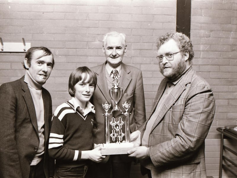 Mr. Paddy Doherty, St Peter's CBS, presenting the St. Peter's Trophy award to the pupils of St. Peter's for outstanding achievement in the D&D competitions to John Logue of the Brandywell Harps under-12 team in winning the NIBFA Trophy. Also in the picture are Eamonn Friel, treasurer, and Mr. Jack McTaggart, chairman.