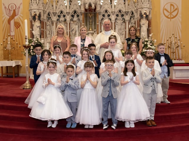 Pupils from Good Shepherd Primary School, Derry who received the Sacrament of First Holy Communion from Fr. Michael Canny at St. Columba's Church, Chapel Road on Friday last. Included at back is Mrs. Natasha Ferguson, Learning Support, Mrs. Suzann McCafferty, Principal and Mrs. Roisin Connors, teacher. (Photo Jim McCafferty Photography)
