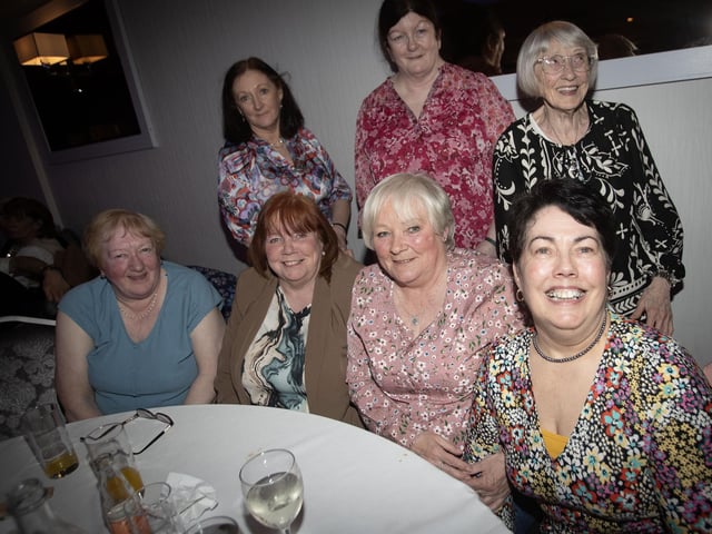 Friends gathering together for a photo at Tuesday's Triax 60s/70s Spectacular.