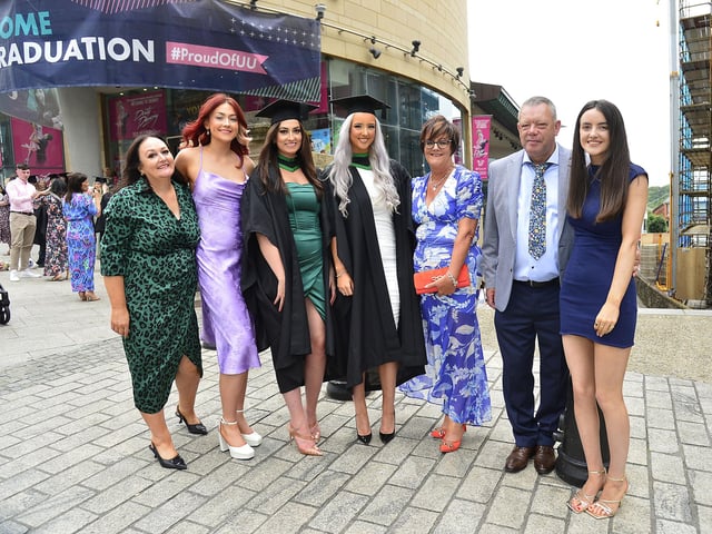 Graduates Kathryn Black from Belfast, who graduated in Information Technologies and Georgina Houston from Antrim, who graduated in Computer Science, pictured with family Joanne Black, Beth Black, Valerie Houston, Robert Houston and Charlotte Houston in Derry at the Millennium Forum. Picture By: Arthur Allison/Pacemaker Press