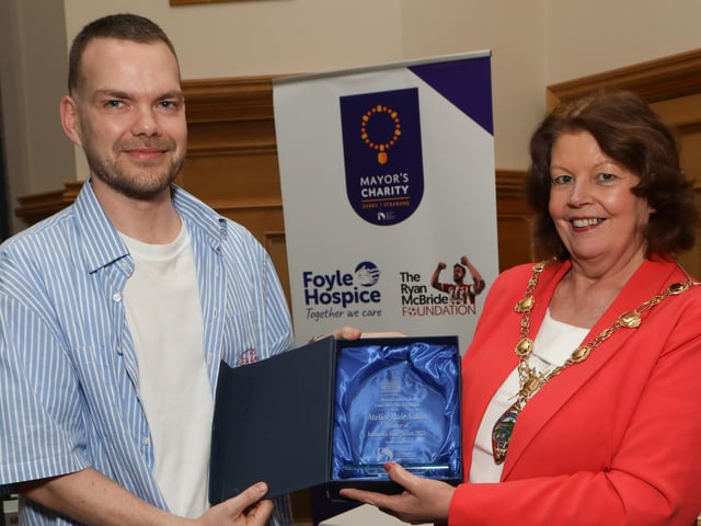 Atelier Hair Salon reception 1 - Mayor Patricia Logue presenting a piece of commemorative crystal to Ronan Stewartl, to mark the success of Atelier Hair Salon winning the All Ireland Salon of the Year Competition. (Photo - Tom Heaney, nwpresspics)