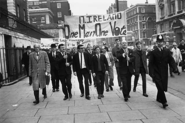 23rd January 1969: Demonstrators marching from Trafalgar Square to Downing Street carrying a banner, which reads 'N Ireland, One Man One Vote'. (Photo by Bob Aylott/Keystone/Getty Images)