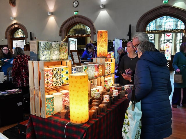 People browse the large range of gifts at the Guildhall Christmas Fair on Friday afternoon. Photo: George Sweeney / Derry Journal