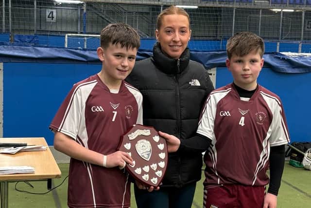 St Canice's captains receiving the Derry County hurling trophy