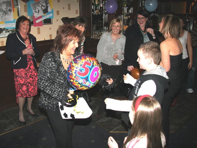 Ann greeted by family and friends at her surprise 50th birthday party at The Phoenix Bar 0042JML : Parties and nights out in March 2006
