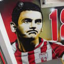 The Mark Farren mural in the tunnel of the stand named in the late striker's memory.