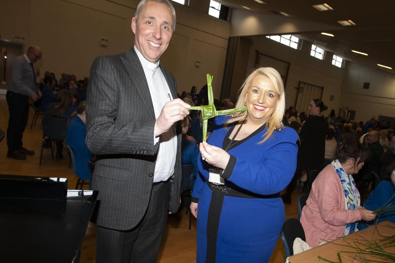 School Chaplain Fr. Paul Farren and Vice Principal Ms. Roisin Rice pictured with one of the St. Brigid’s crosses made during Wednesday’s Grandparents To School Day.
