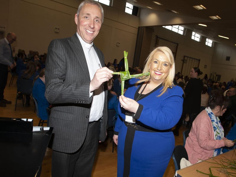School Chaplain Fr. Paul Farren and Vice Principal Ms. Roisin Rice pictured with one of the St. Brigid’s crosses made during Wednesday’s Grandparents To School Day.