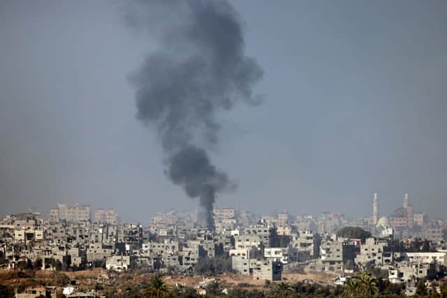 This picture taken from the Israeli border with the Gaza Strip shows smoke billowing over central Gaza following Israeli strikes on January 1, 2024, amid the ongoing battles between Israel and the militant Hamas group. (Photo by Menahem KAHANA / AFP) (Photo by MENAHEM KAHANA/AFP via Getty Images)
