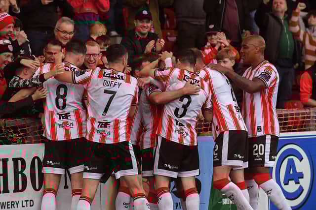 Delighted Derry City players and fans celebrate Danny Mullen’s goal against Shelbourne in the cup. Photograph: George Sweeney