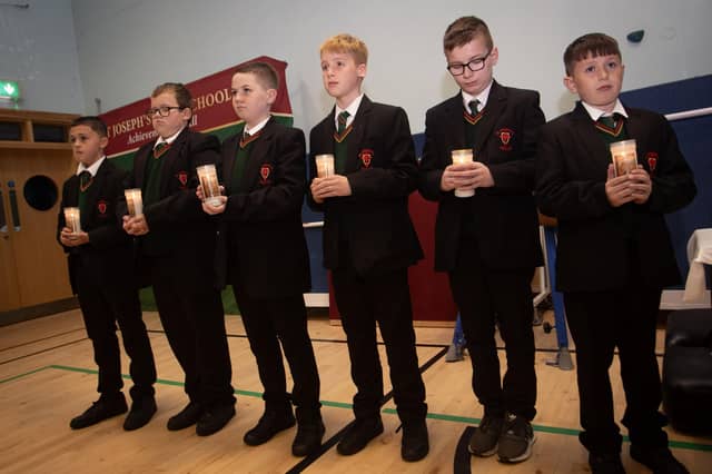 Year 8 students Harry, Brandon, Conlaoth, Charlie, Bobby and Conor prepare to carry the Class Candles to the altar during Thursday's Induction Mass. (Photos: Jim McCafferty Photography)