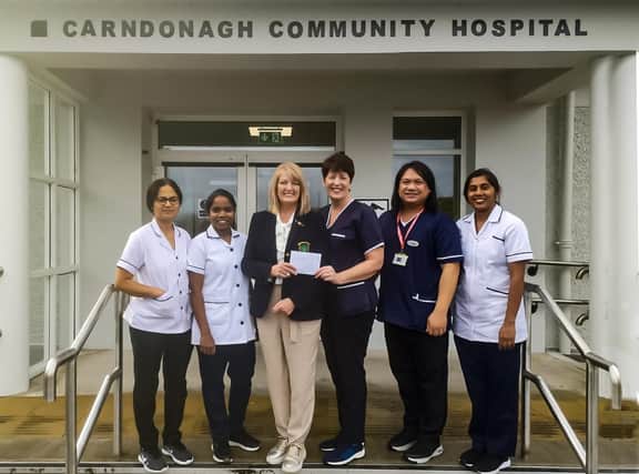 Greencastle Golf Club, Ladies Branch to Carndonagh Community Hospital - Lady Captain, Isobel McCafferty presenting the cheque to Mairead O'Neill, CNM1. Also present - Chinju Johny, Staff Nurse; Sanilamol Sunny, Staff Nurse; Amie Tayoco, CNM2; Litha Lukose, Staff Nurse; Paul Pearson, MTA. Open Charity Stableford competition sponsored by Mulhall Contracts.