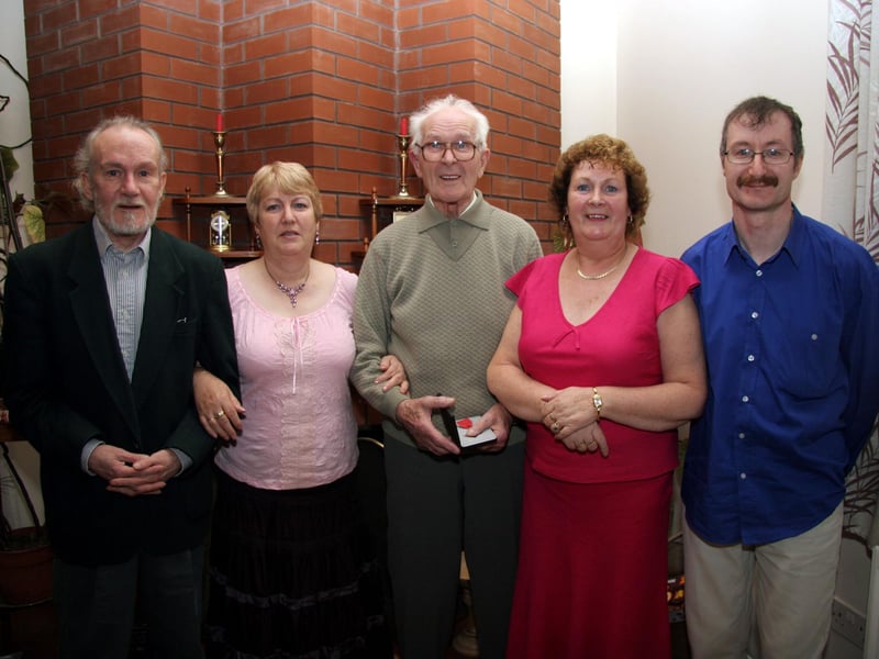Proud sons, Carl, Derek and daughters, Barbara and Frankie pictured with their dad Tom McGill M.B.E. 0617JML