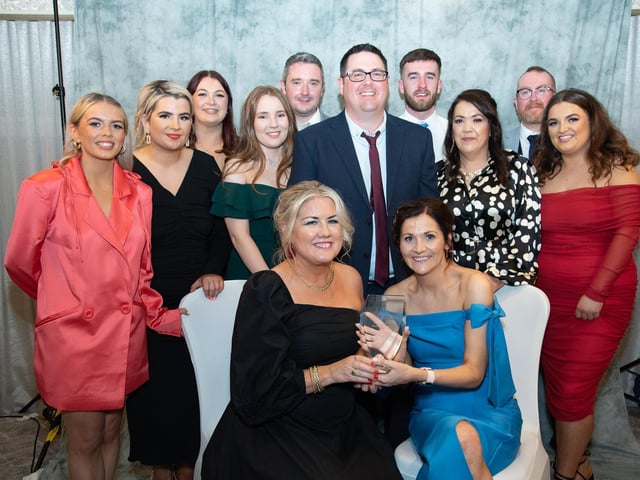 Sharon McDaid presents Mary McLaughlin and her staff with the Pub of the Year Award sponsored by Neal Doherty's Jewellers at the Carndonagh Traders Business and Community Awards in the Ballyliffin Lodge Hotel on Saturday night last. Photo Clive Wasson.
