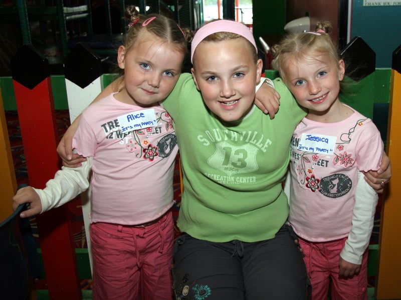 Alice and Jessica pose for a photograph with big sister Amy 0272JML : .