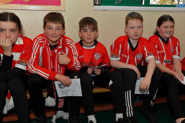 Pupils from Good Shepherd Primary School gave a rapturous welcome to Derry City players Mark Connolly, Liam Mullan and Jack Lemoignan during a visit to the school, with the FAI Cup, on Friday afternoon. Photo: George Sweeney. DER2247GS – 80