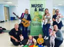 Mayor Sandra Duffy with babies and parents from 'Music and Me', who will be performing at the Mayor's 24 Busk for Homelessness