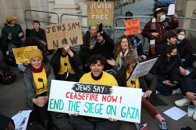 Demonstrators call for a ceasefire in the Israel-Hamas conflict, during a protest outside of the United Kingdom's Foreign, Commonwealth and Development Office, in central London on October 31, 2023. (Photo by DANIEL LEAL/AFP via Getty Images)