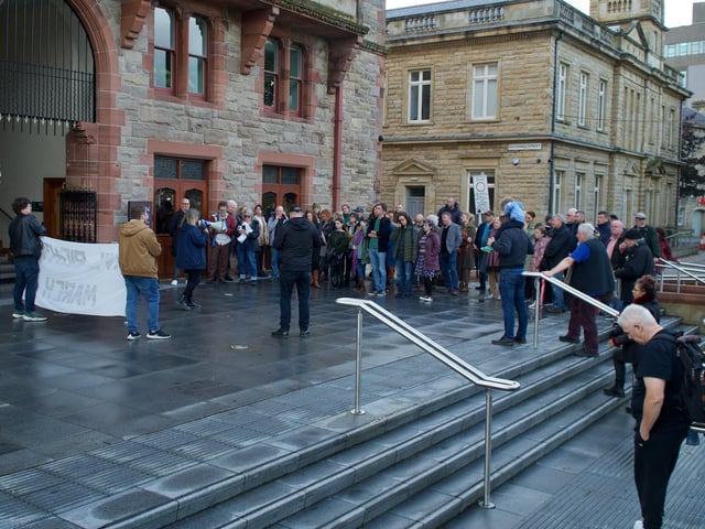 Crowds gather to pay respects.