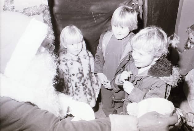 Children meeting Santa Claus at Wellworths shop in Waterloo Place.