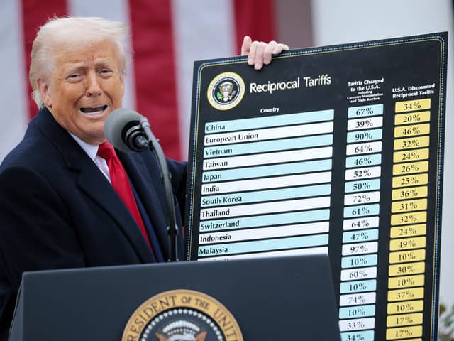 WASHINGTON, DC - APRIL 02: U.S. President Donald Trump holds up a chart while speaking during a “Make America Wealthy Again” trade announcement event in the Rose Garden at the White House on April 2, 2025 in Washington, DC. Touting the event as “Liberation Day”, Trump is expected to announce additional tariffs targeting goods imported to the U.S. (Photo by Chip Somodevilla/Getty Images)