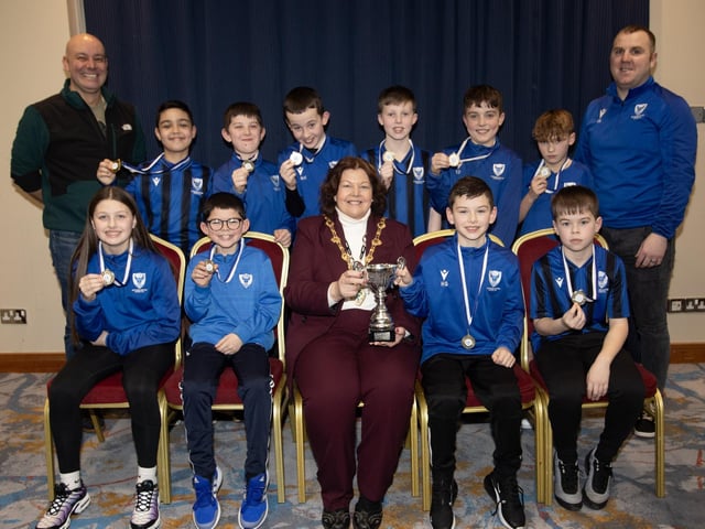 The Mayor of Derry City and Strabane District Council, Patricia Logue, pictured at the D&D Youth FA Annual Awards at the City Hotel on Friday night presents Oxford United U10s with the Winter Cup. Included are coaches Sean Doherty and Christopher Doherty.