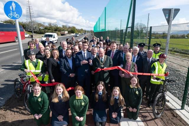 Jack Chambers TD, Minister of State at the Department of Transport and at the Department of Environment, Climate and Communications with council officals and guests at the Muff to Quigleys Point Greenway. Photo Clive Wasson