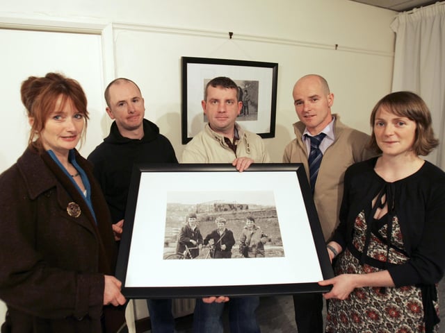 One Day in the Life - Derry photographer Carol McCorkell, left, at the opening of her exhibition at Eden Place Arts Centre, Pilots Row. The exhibition was a collection of photographs taken locally on December 8th 1981. Included, from left are John Black, Charley Casey and Sean Taggart, who feature in the images, and Judi Logue, Cart Centre co-ordinator. (2911C10)